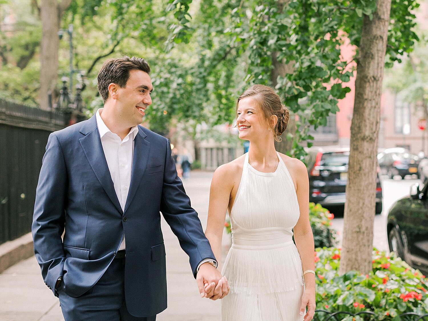 engaged couple walks through NYC neighborhood | Asher Gardner Photography | Gramercy Park Engagement Session