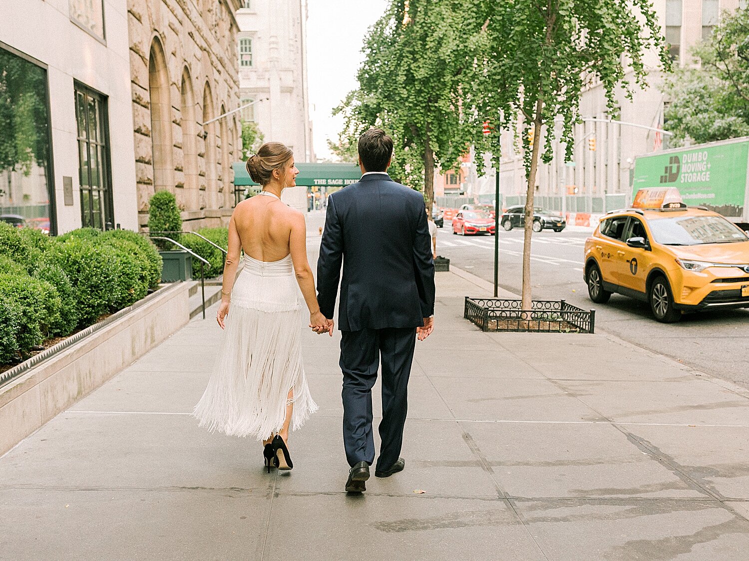 engaged couple walks through street in NYC | Asher Gardner Photography | Gramercy Park Engagement Session