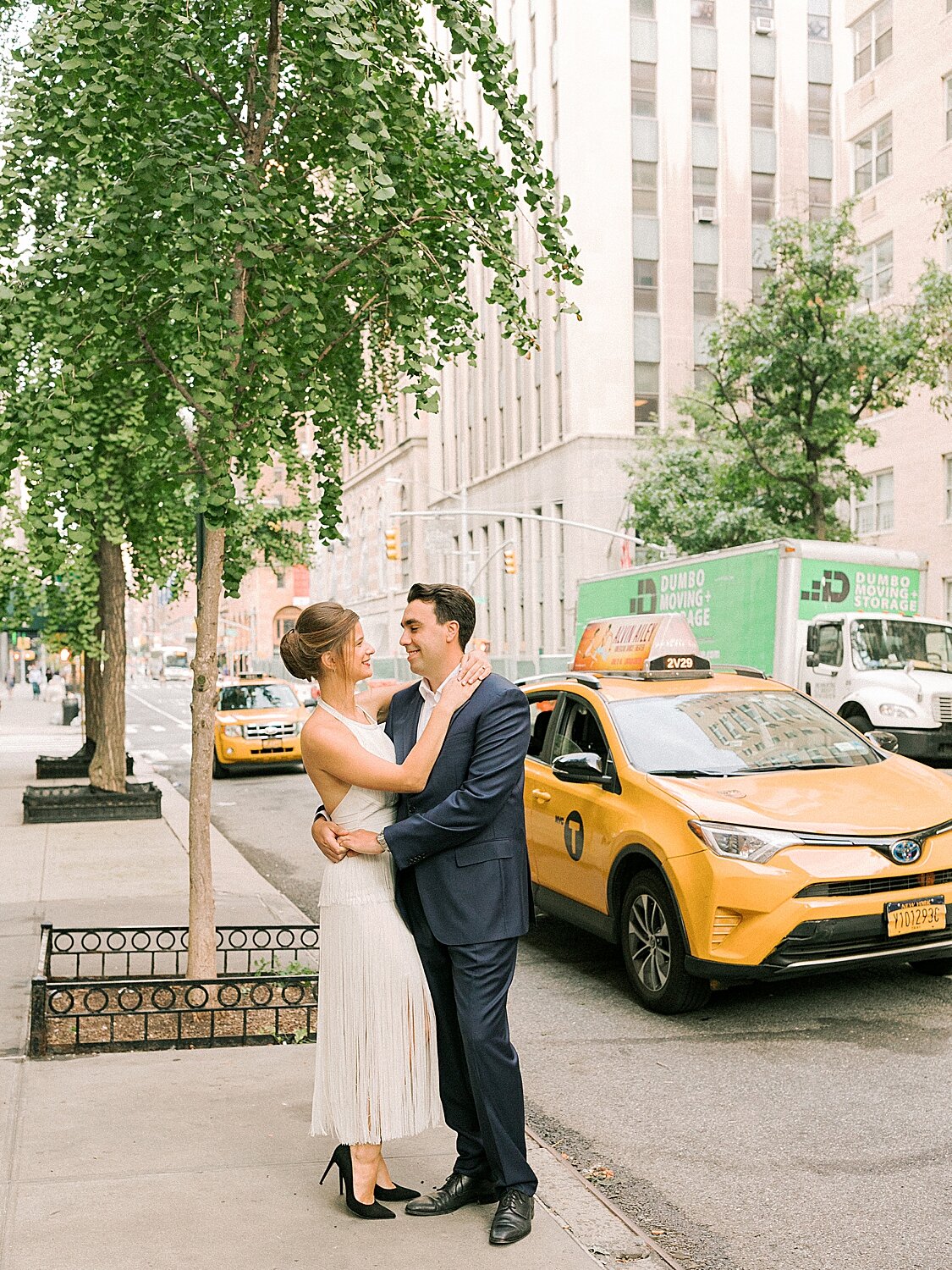 engaged couple poses by NYC taxi | Asher Gardner Photography | Gramercy Park Engagement Session