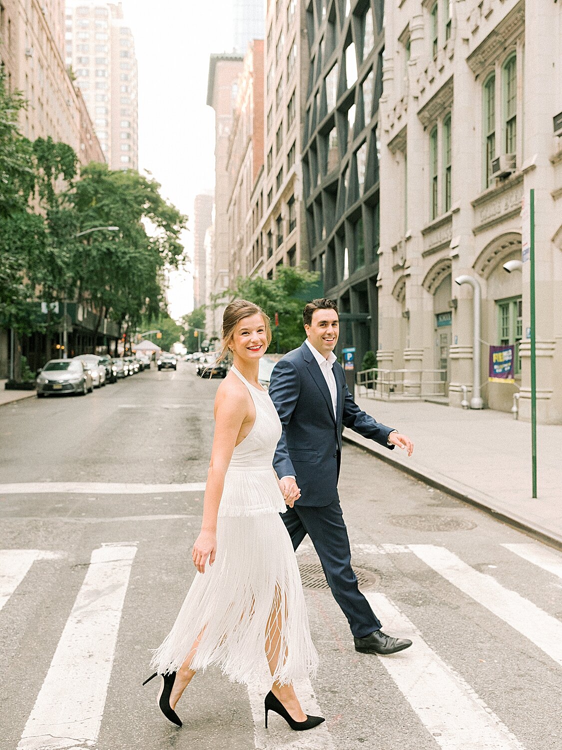 engaged couple walks through crosswalk | Asher Gardner Photography | Gramercy Park Engagement Session