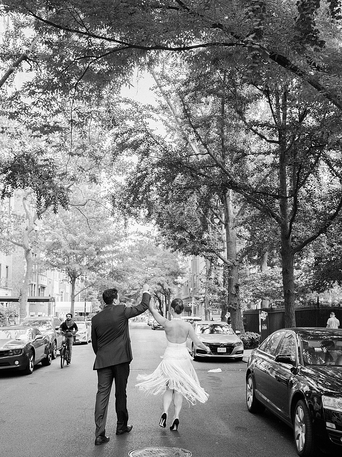 groom twirls bride during engagement photos | Asher Gardner Photography | Gramercy Park Engagement Session