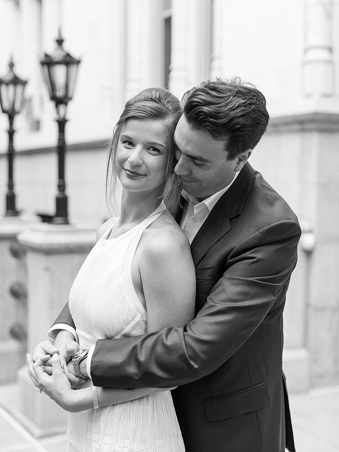 groom hugs bride during NY photos | Asher Gardner Photography | Gramercy Park Engagement Session