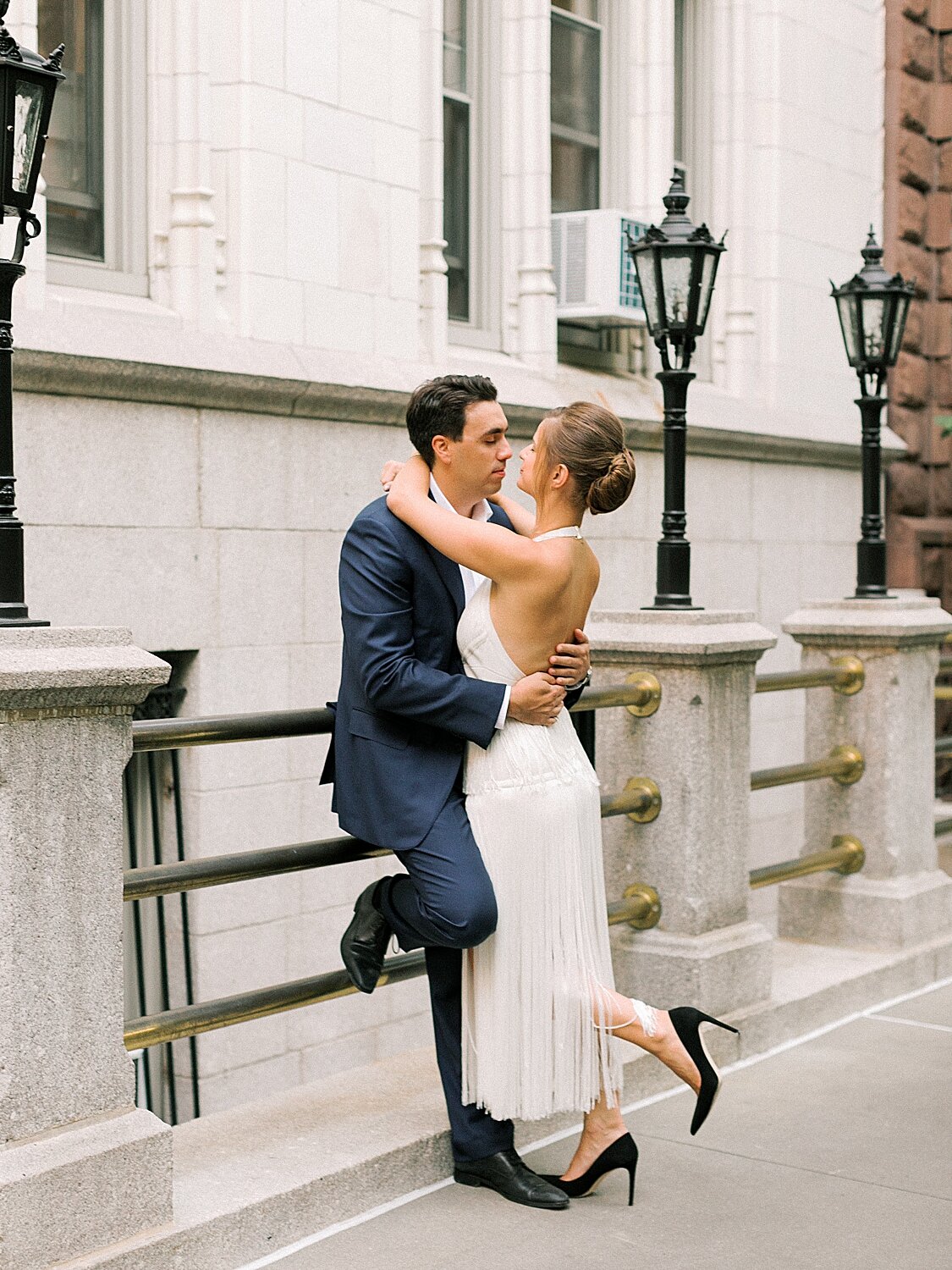 engaged couple kisses outside Gramercy Park homes | Asher Gardner Photography | Gramercy Park Engagement Session