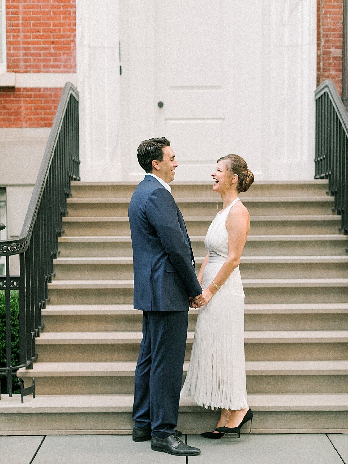 bride and groom pose by steps | Asher Gardner Photography | Gramercy Park Engagement Session