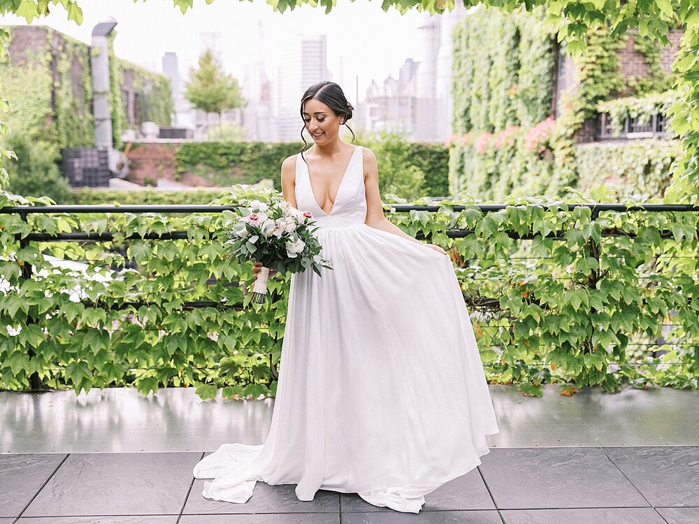 bride twirls wedding gown in New York City | Tri-State area wedding venues photographed by Asher Gardner Photography
