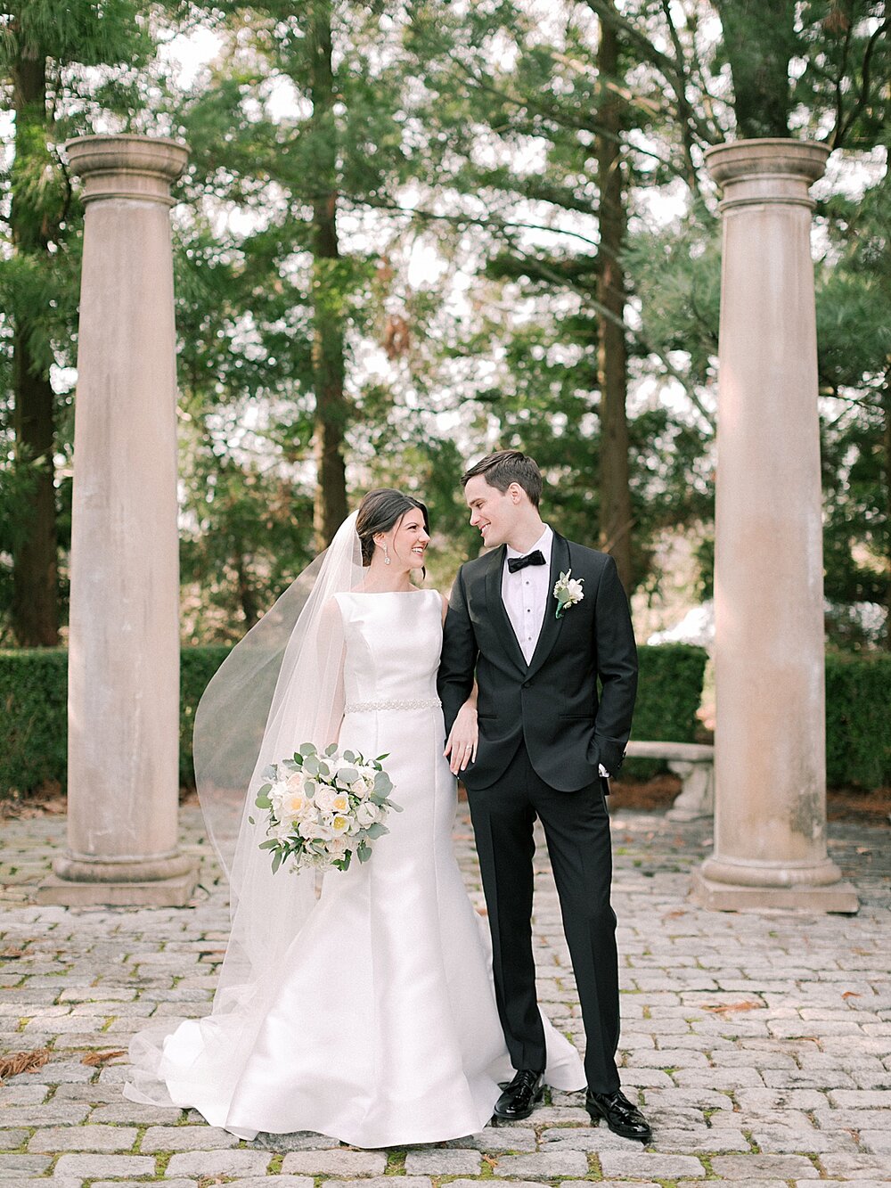 bride and groom pose in gardens of Ashford Estate | Tri-State area wedding venues photographed by Asher Gardner Photography