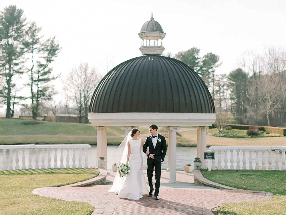 bride and groom pose by gazebo at Ashford Estate | Tri-State area wedding venues photographed by Asher Gardner Photography