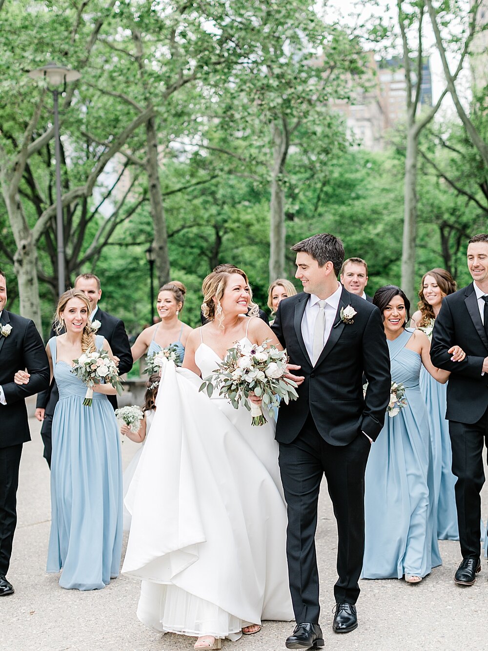 wedding party walks through Battery Park | Tri-State area wedding venues photographed by Asher Gardner Photography