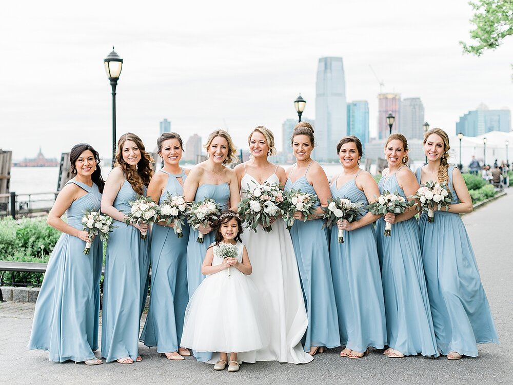 bride and bridesmaids pose by Central Park in blue gowns | Tri-State area wedding venues photographed by Asher Gardner Photography