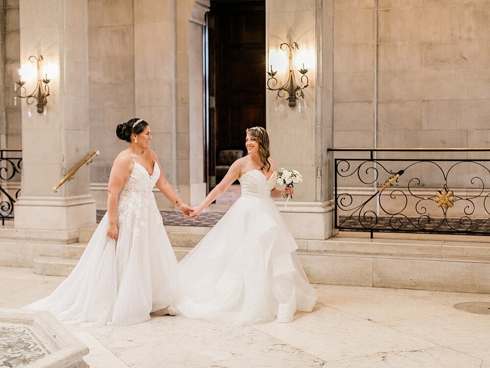 brides walk through Hempstead House | Tri-State area wedding venues photographed by Asher Gardner Photography