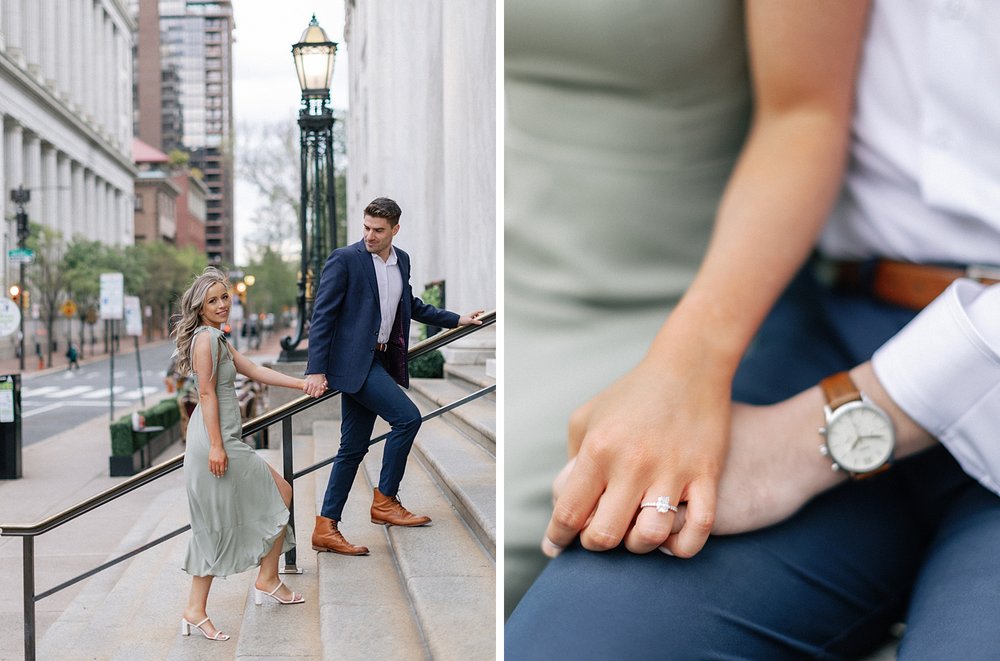 woman holds man's hand showing off engagement ring on steps of the Merchant Exchange Building