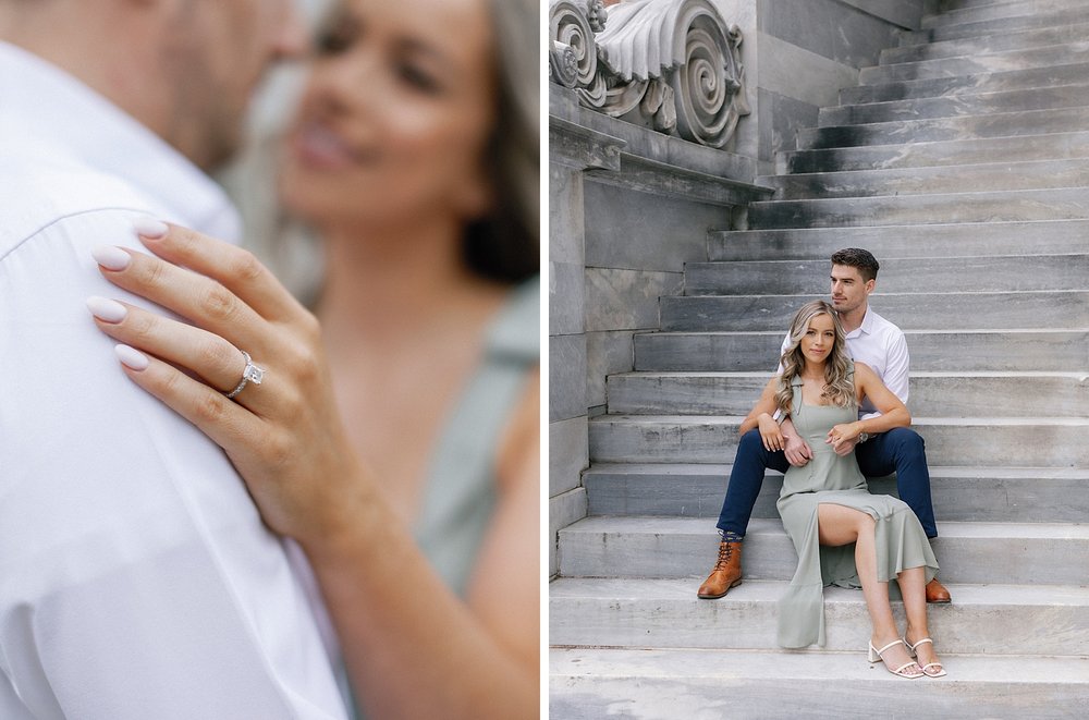 woman holds man's shoulder showing off engagement ring on steps of the Merchant Exchange Building