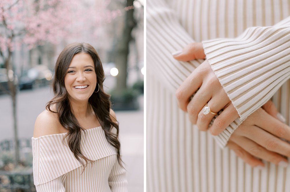woman stands in tan sweater dress showing off engagement ring during NYC engagement photos