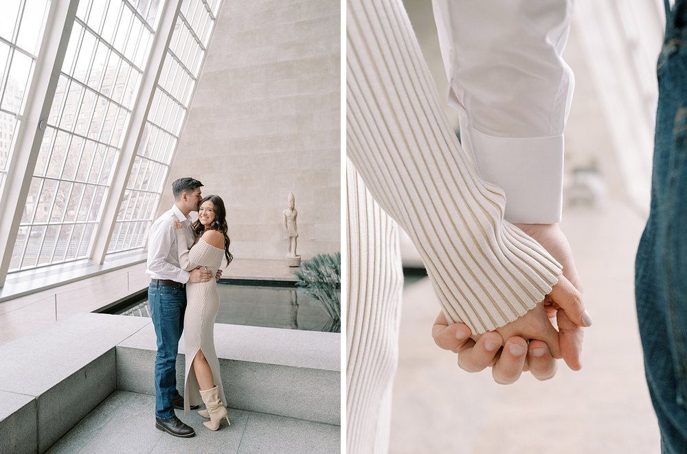 man hugs woman in tan sweater dress inside exhibit at the Metropolitan Museum of Art