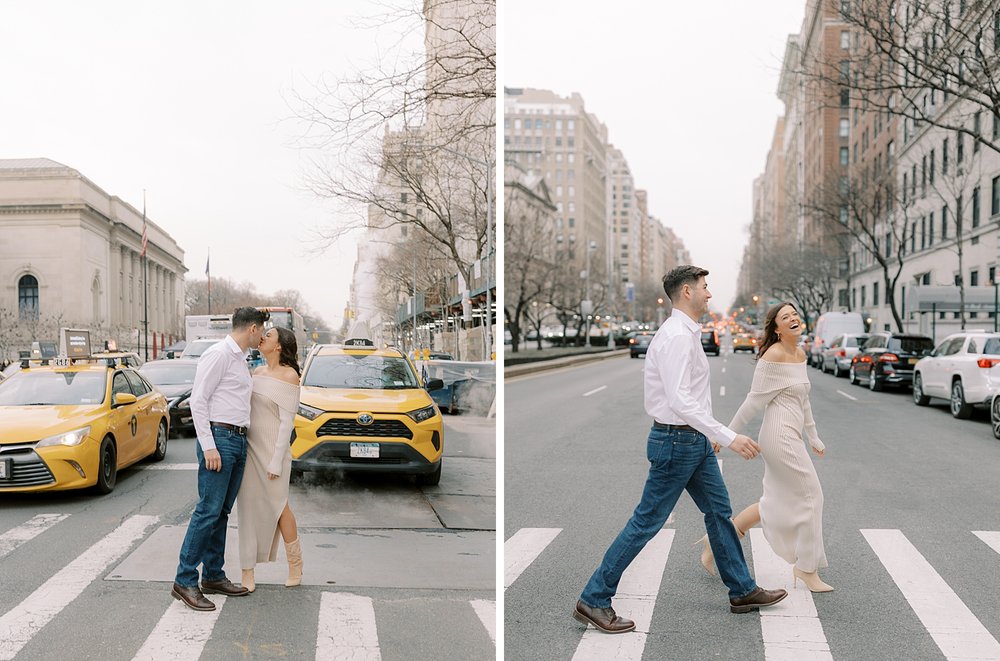 man and woman kiss in crosswalk on the Upper East Side of NYC with taxis behind them