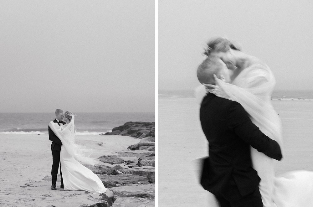 bride and groom kiss on rocky path on Long Island beach