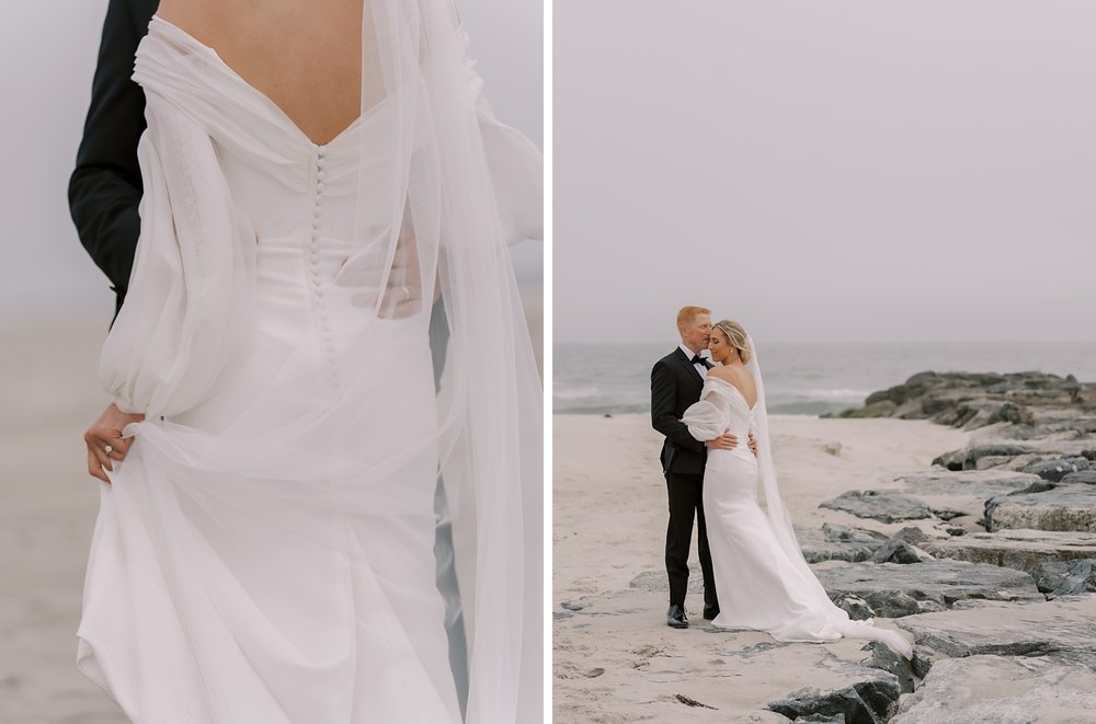 bride and groom stand on rocks on Long Island beach hugging