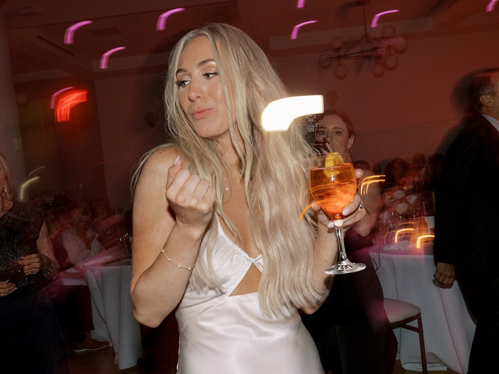 bride dances during Long Island beach wedding reception