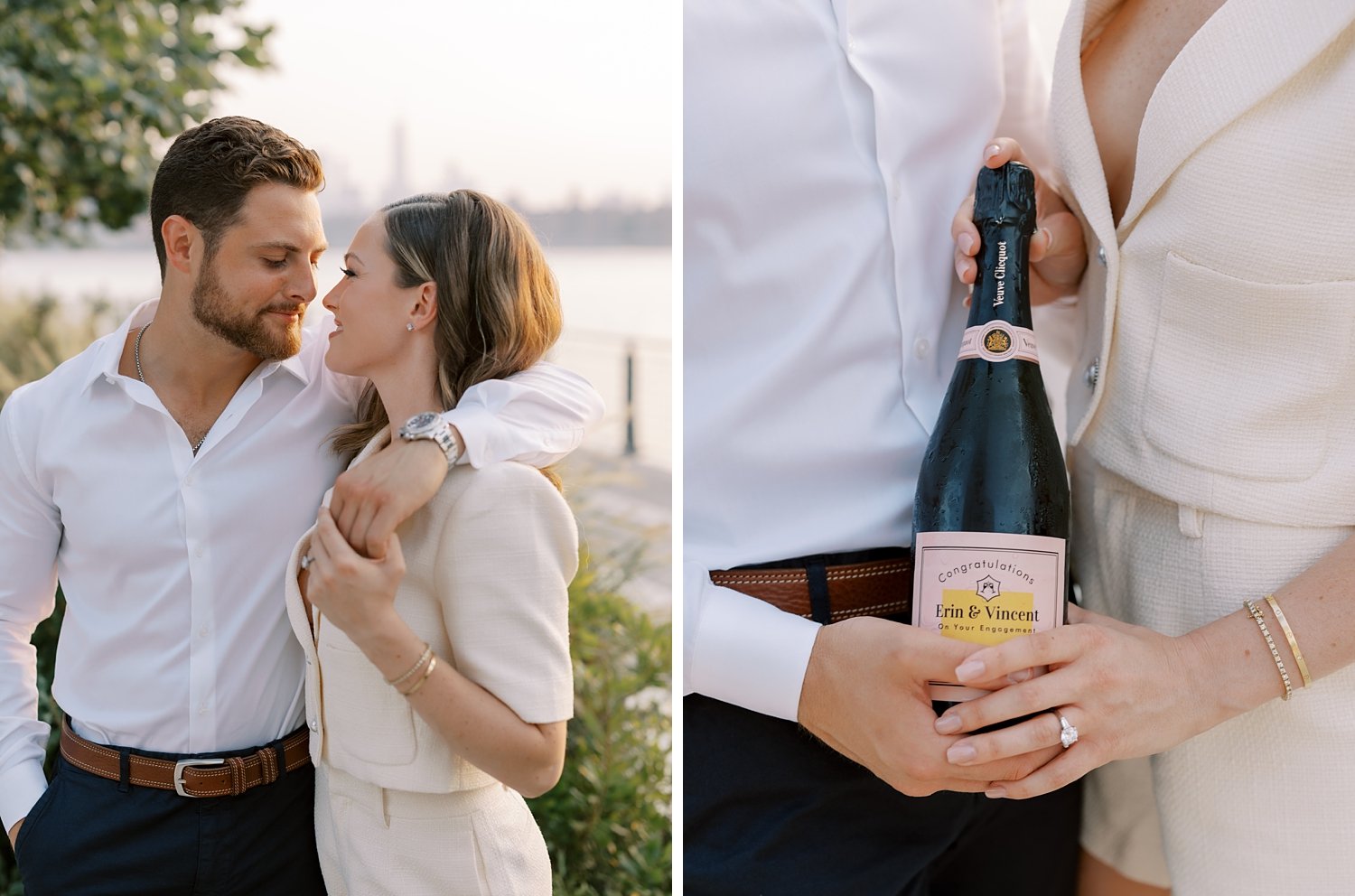 engaged couple hugs and holds champagne bottle standing in Greenpoint Waterfront Park