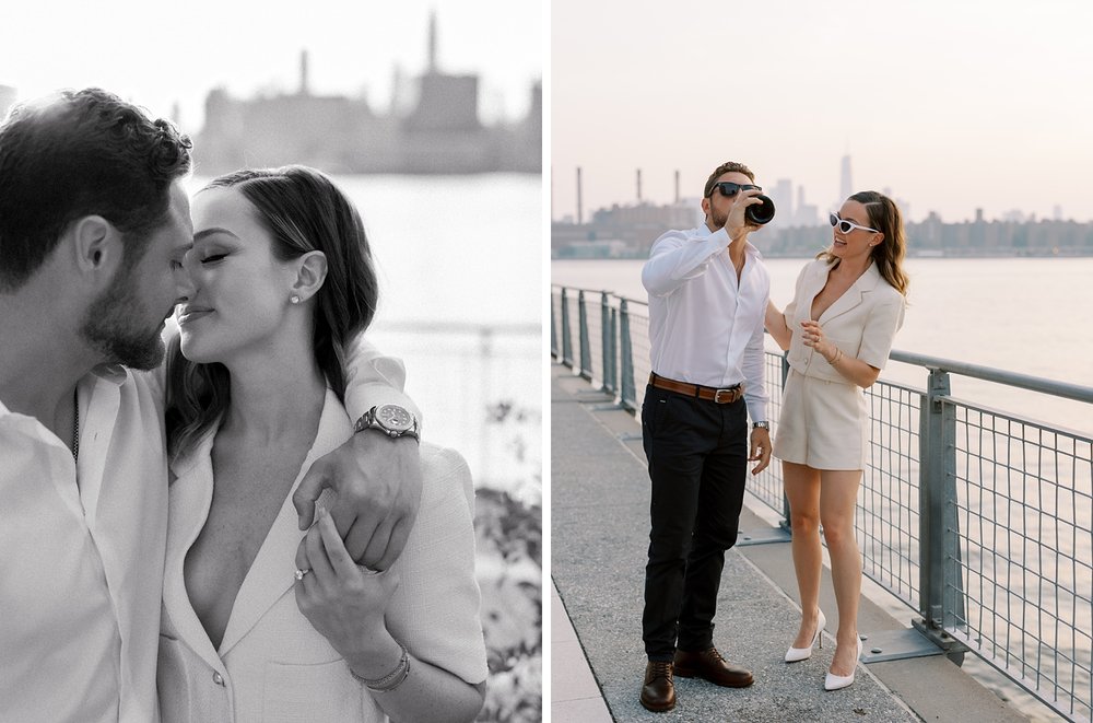 engaged couple opens bottle of champagne along fence in Greenpoint Waterfront Park