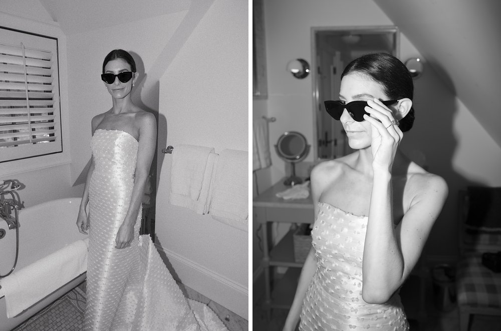 bride in sunglasses poses in bathroom at The Country Club of New Canaan