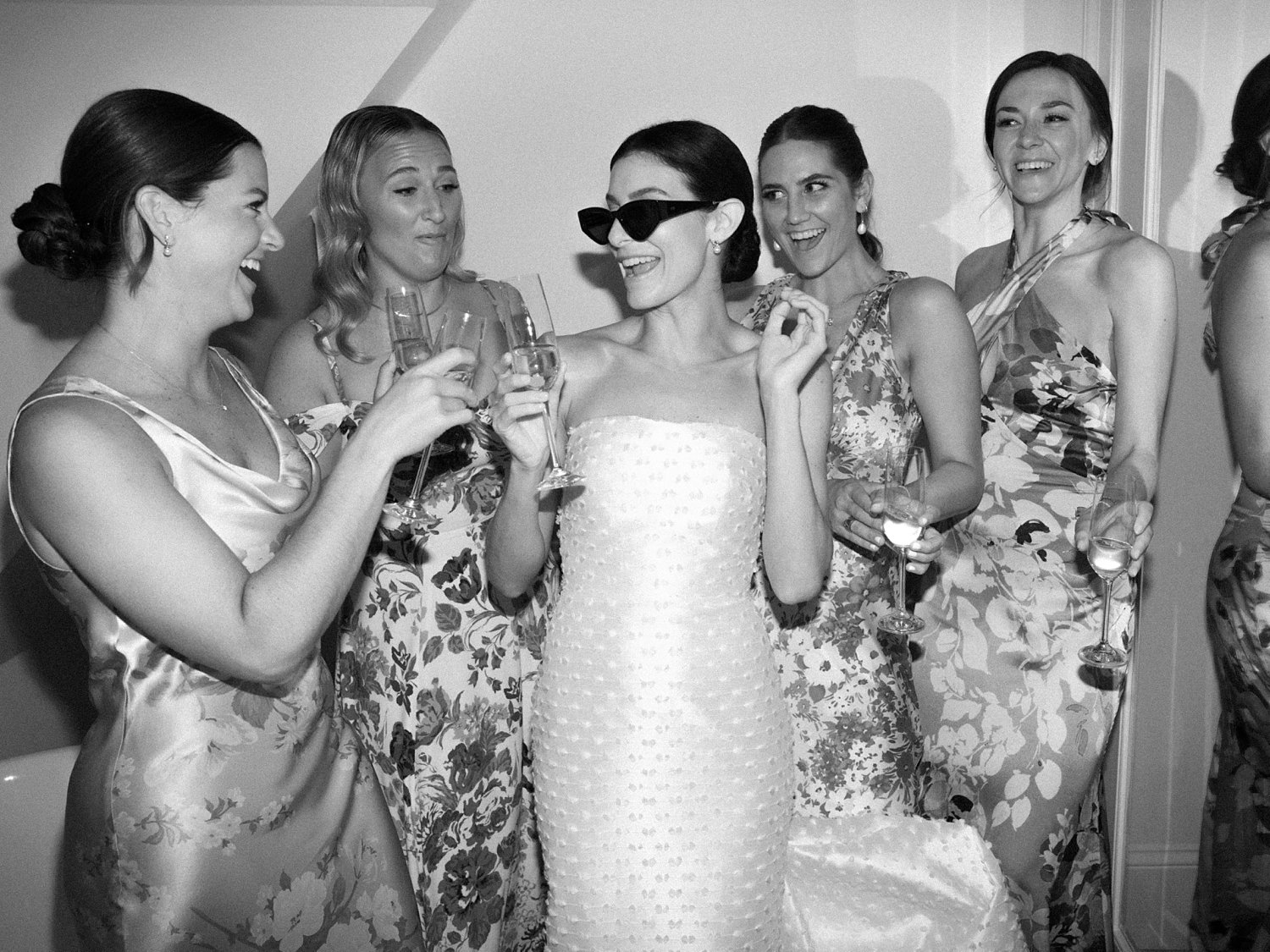 bride in sunglasses toasts drinks with bridesmaids in Connecticut 