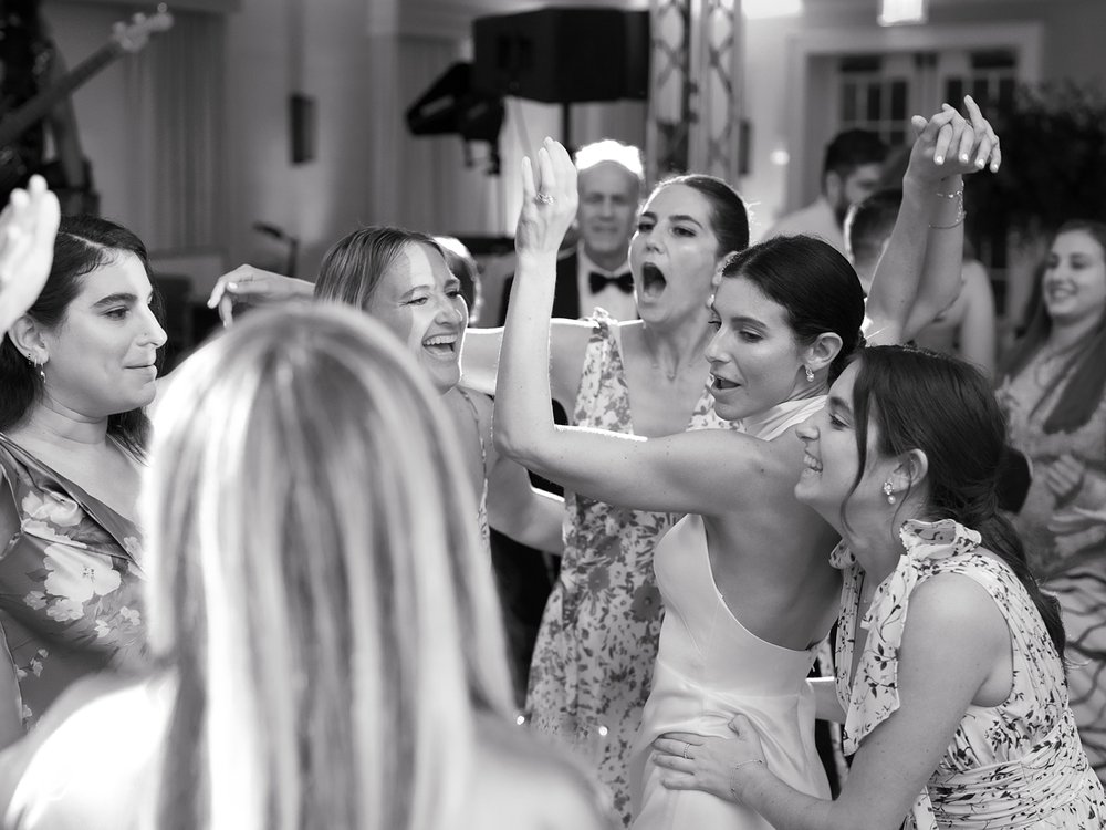 bride dances with bridesmaids during New Canaan wedding reception