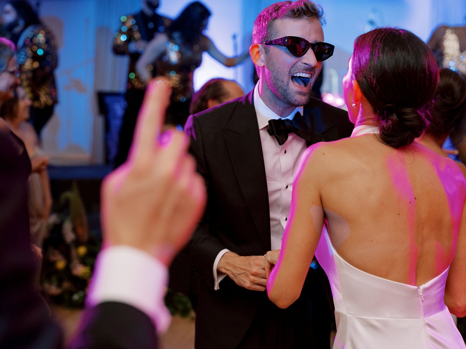 bride and groom sing dancing to live band at New England wedding reception 