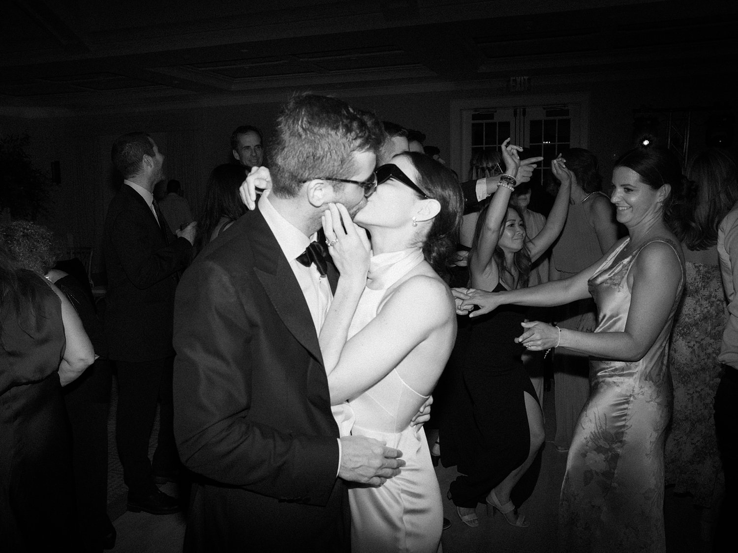 bride and groom kiss on dance floor during New Canaan wedding reception
