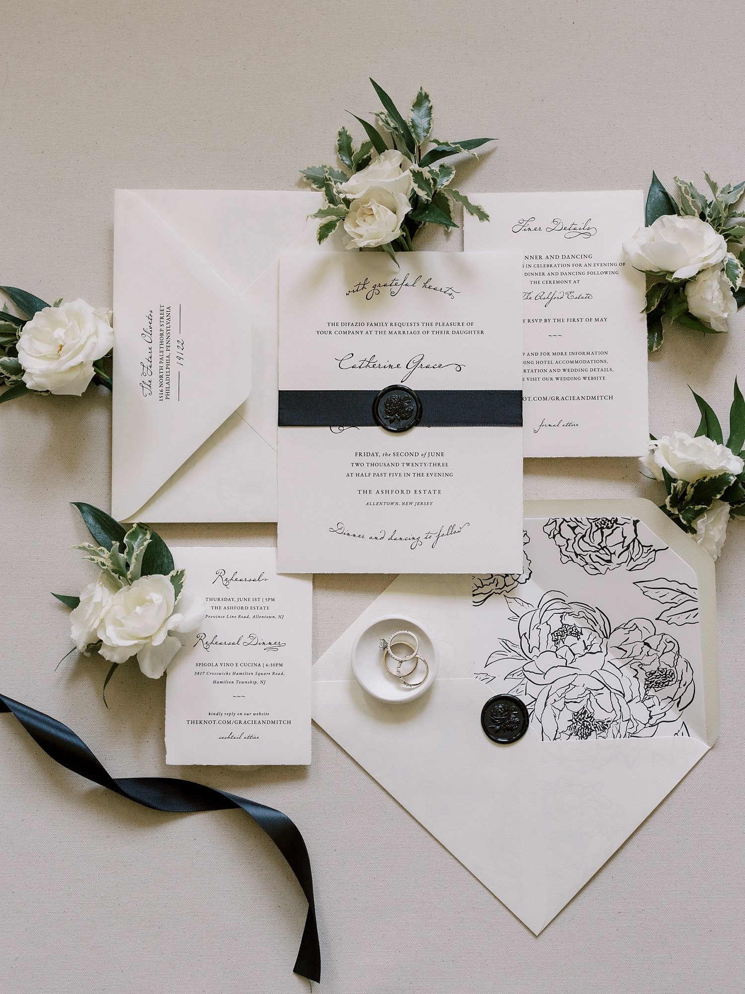 black and white stationery set with black ribbon and wax seal