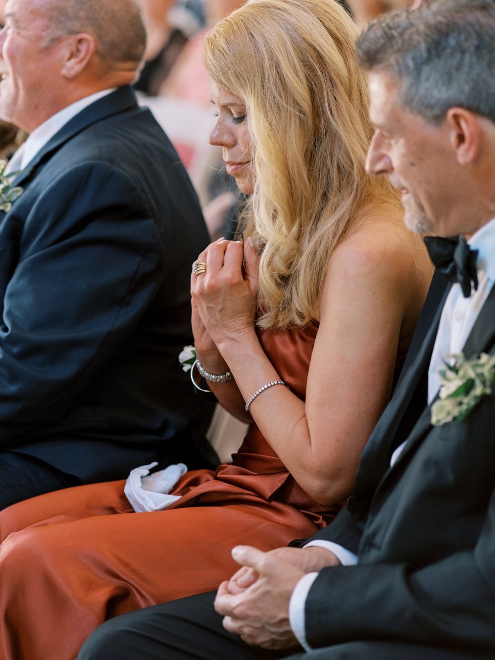 wedding guest holds rings during ring warming