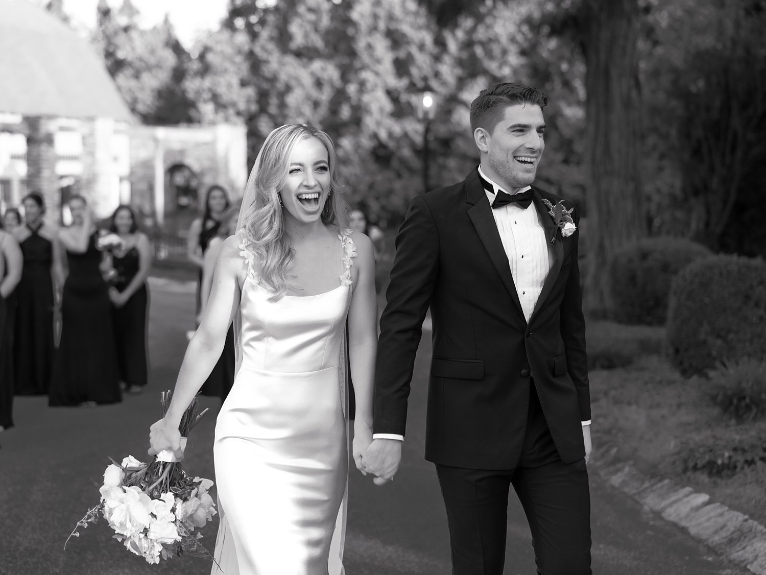 bride and groom smile laughing walking down driveway at the Ashford Estate