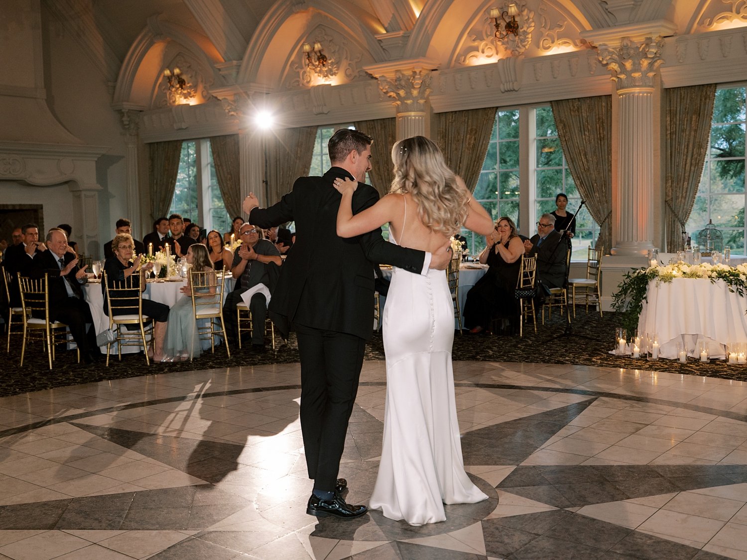 newlyweds dance on dance floor inside the Ashford Estate