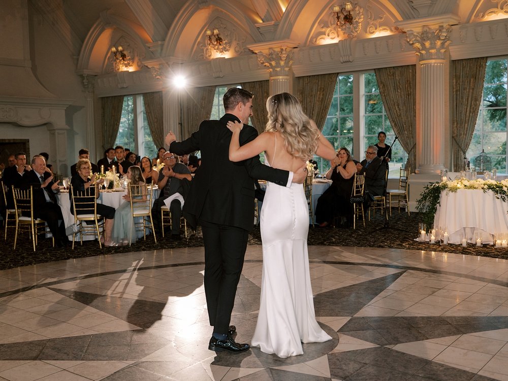 newlyweds dance on dance floor inside the Ashford Estate