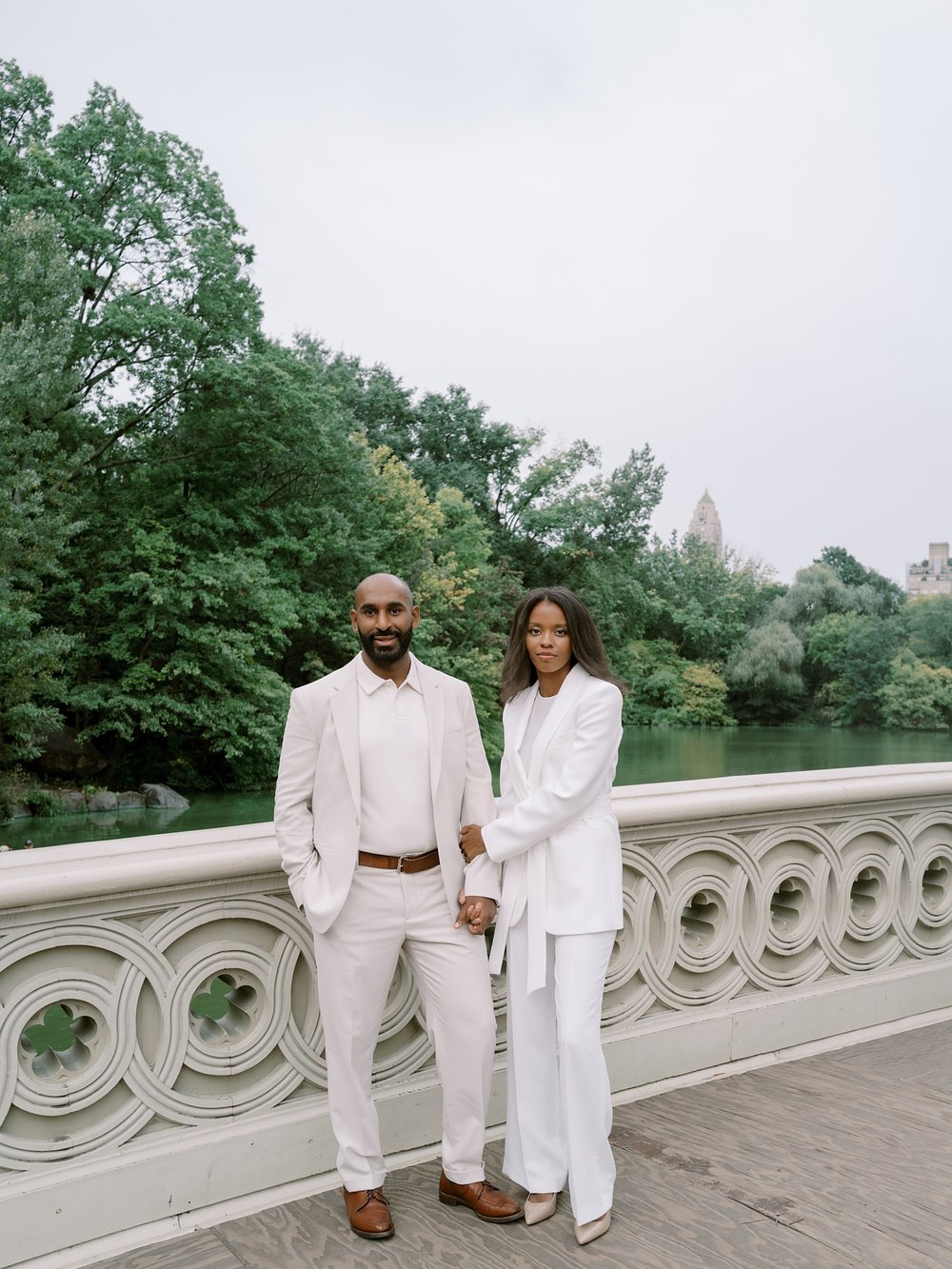 married couple stands on bride inside Central Park in New York City