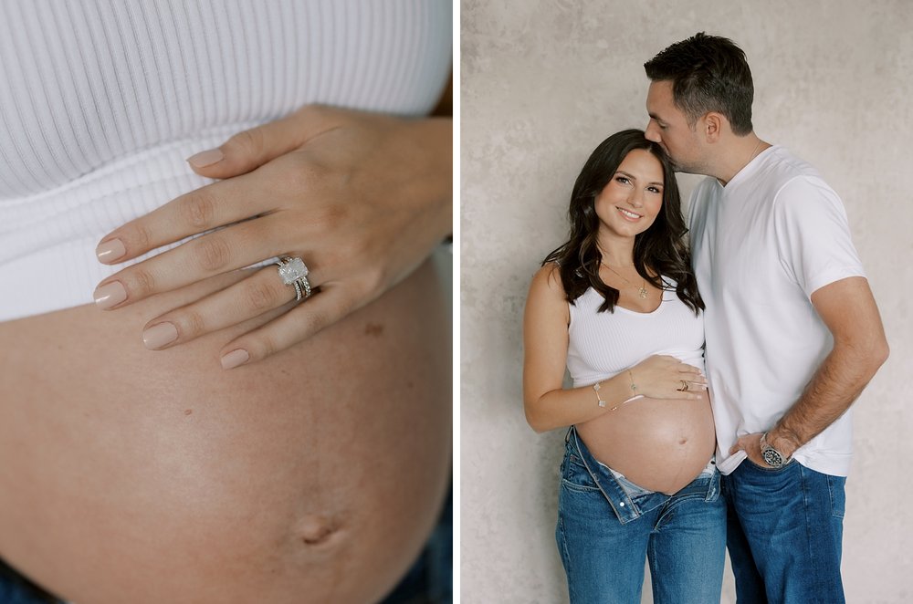 woman holds baby bump showing off wedding rings