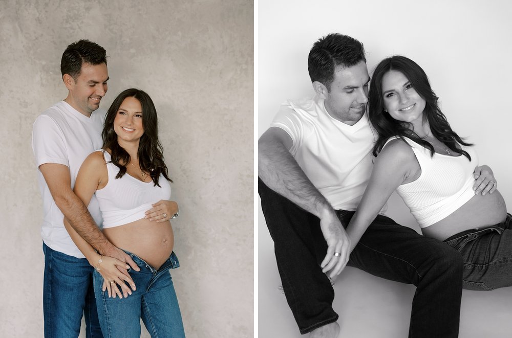man hugs expecting wife around middle during studio maternity photos
