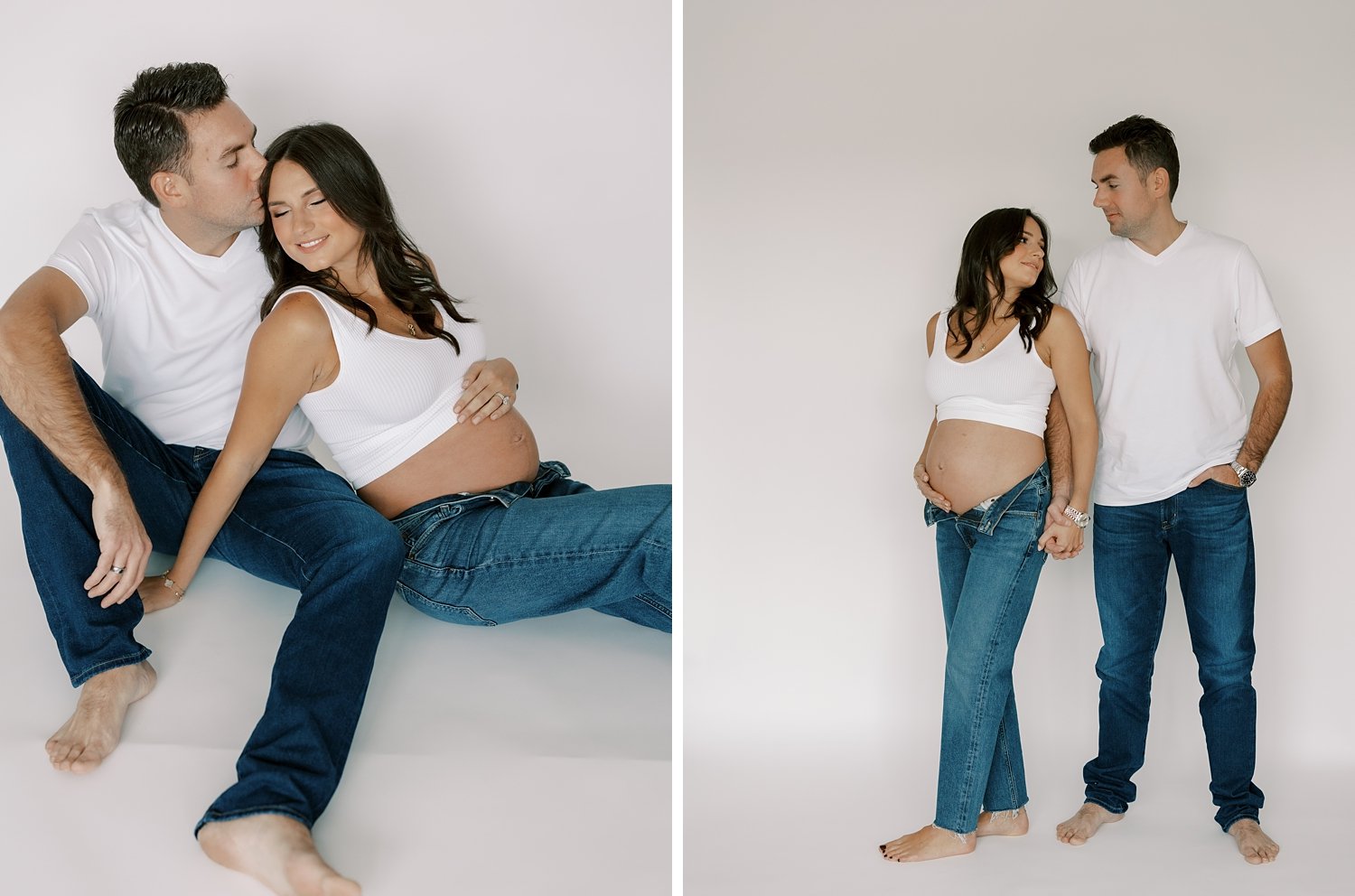 married couple poses in jeans and white shirts during studio maternity session