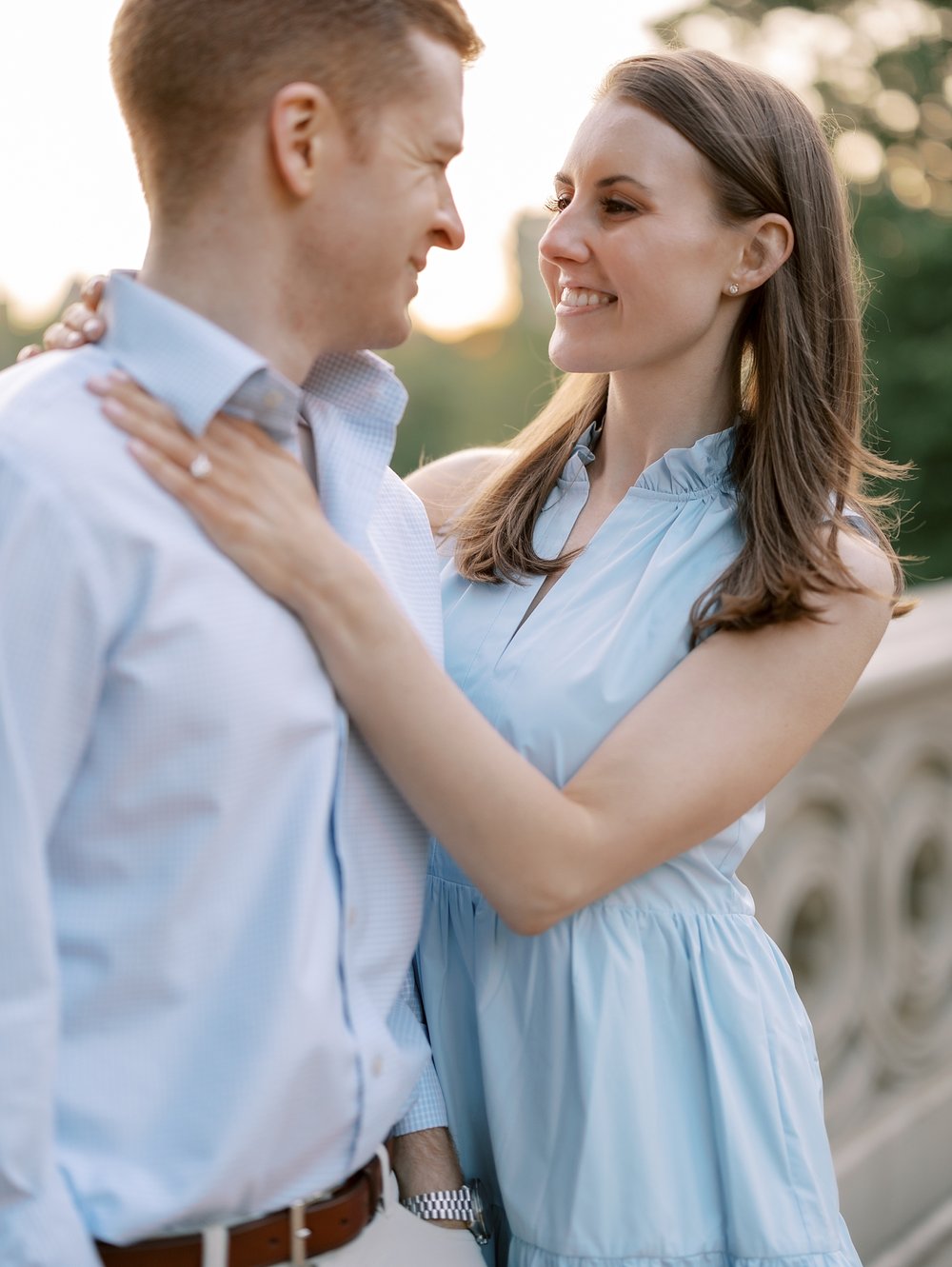 woman smiles at fiancee during engagement session in Central Park
