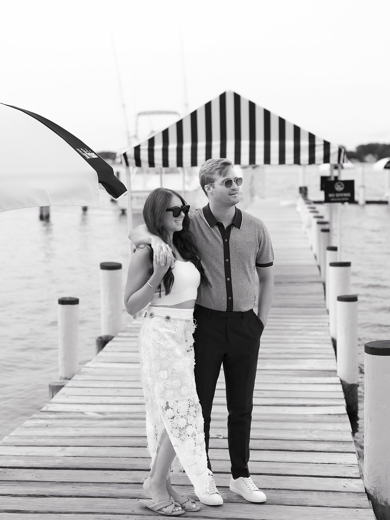 man hugs woman around neck on dock outside the Pridwin on Shelter Island NY