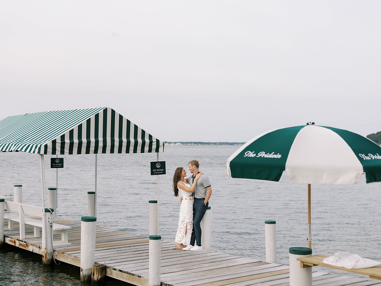 man and woman walk on dock outside the Pridwin on Shelter Island NY