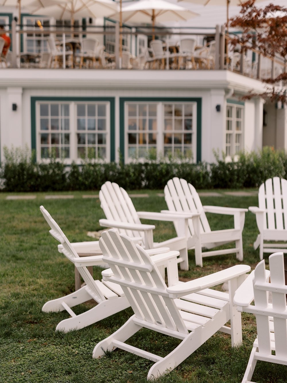white Adirondack chairs outside Shelter Island hotel