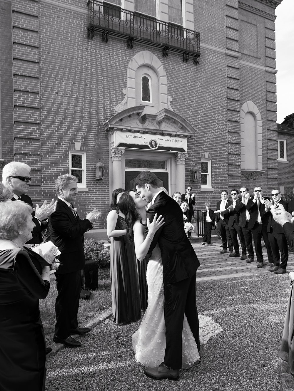 bride and groom kiss outside chapel in New Jersey