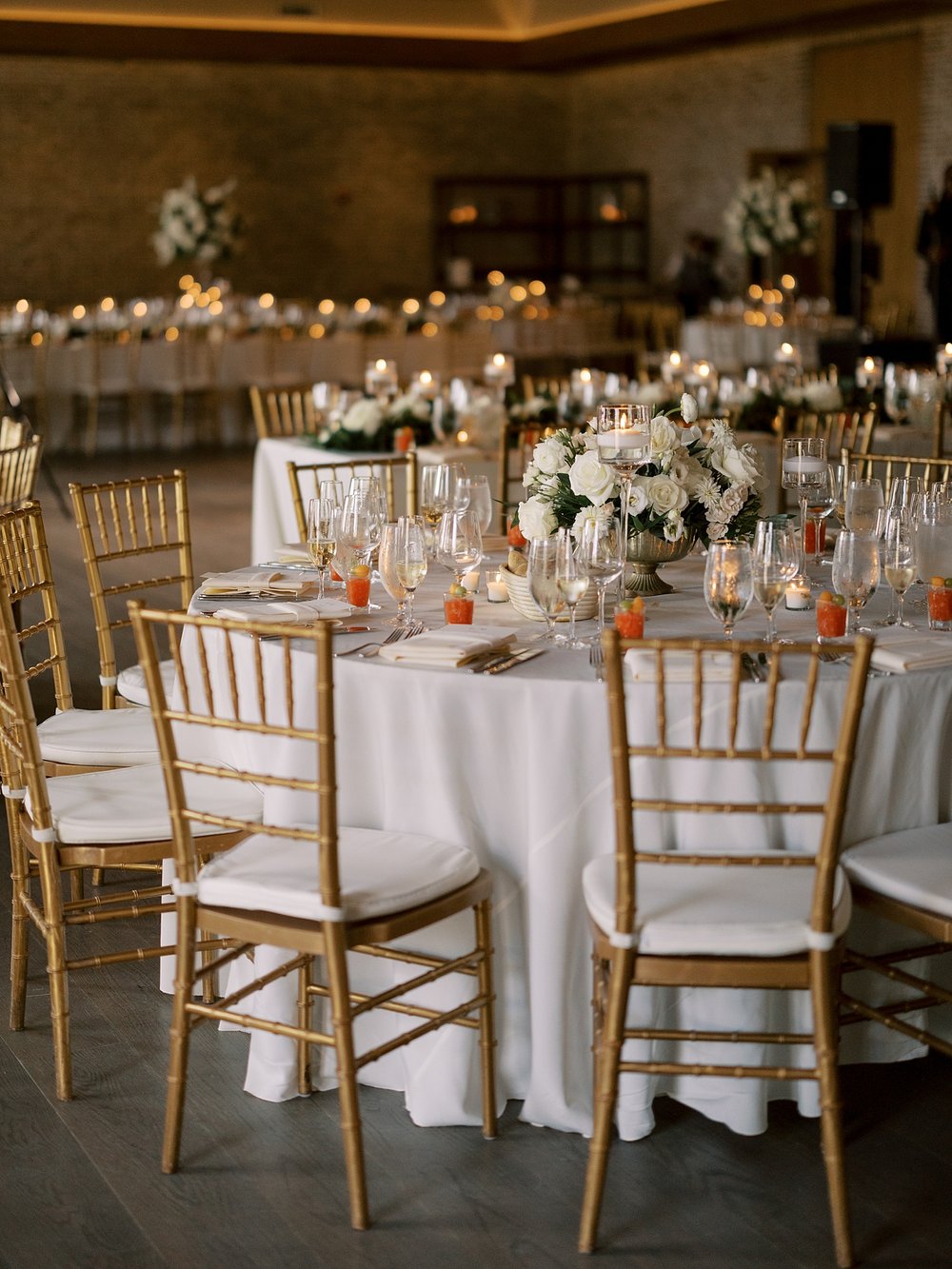 wedding reception with ivory floral centerpieces at Pendry Natirar