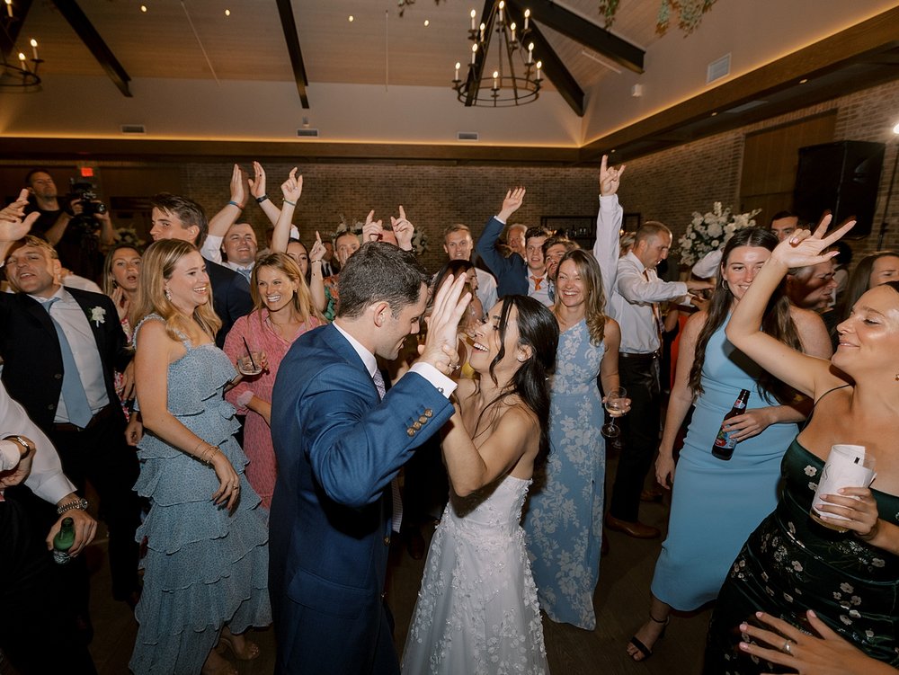 newlyweds dance surrounded by bridal party during Pendry Natirar wedding reception