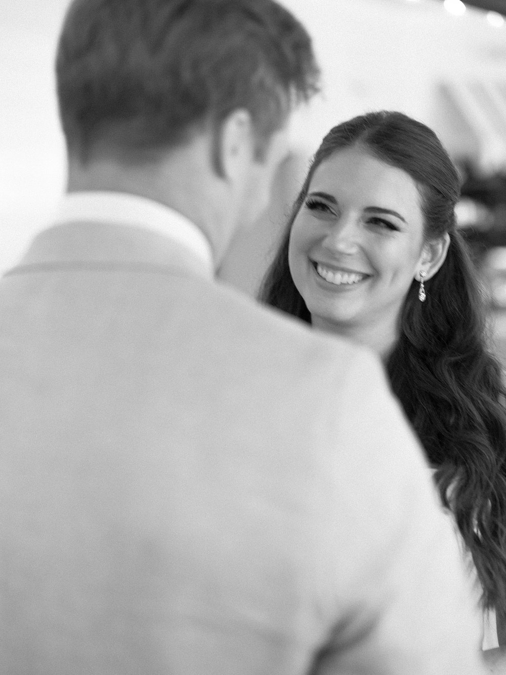 bride smiles at groom during first look at the Pridwin