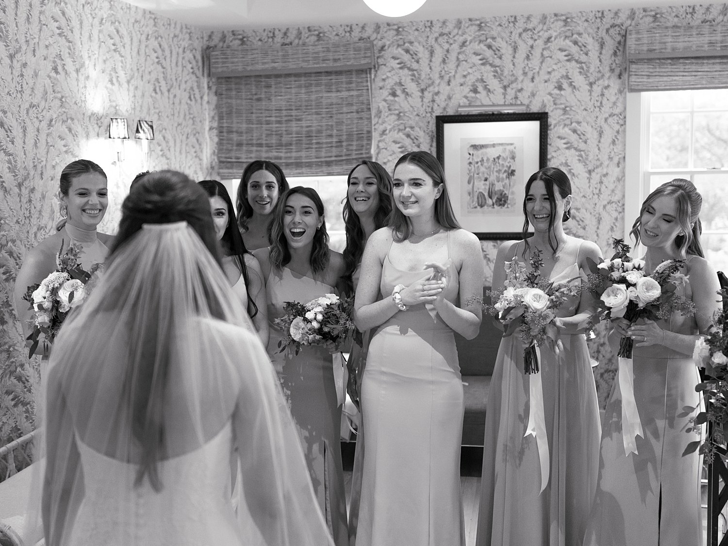 bride has first look with bridesmaids inside the Pridwin