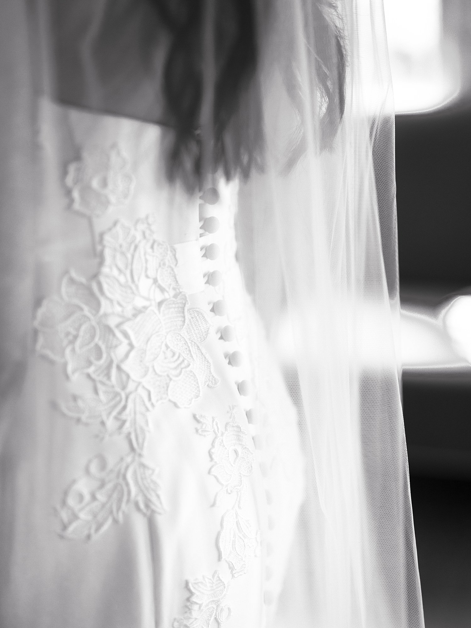 buttons down the back of bride's gown