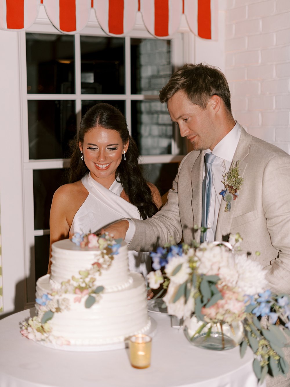 bride and groom cut wedding cake at the Pridwin