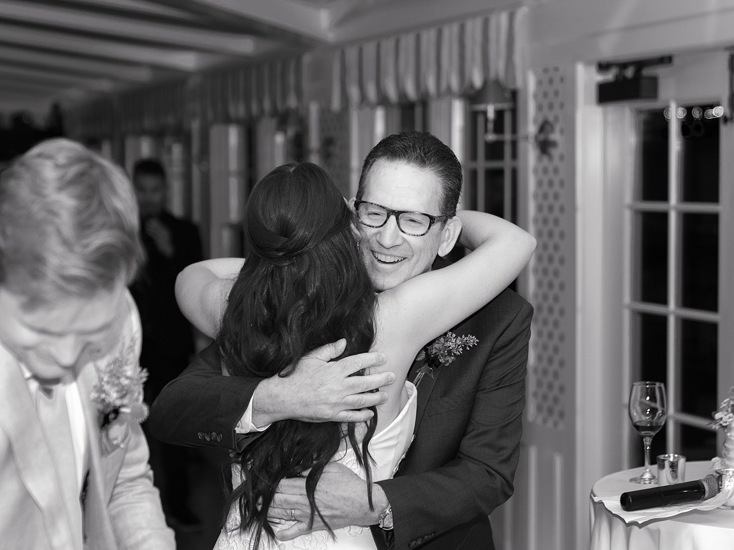 bride hugs guest during Shelter Island wedding reception